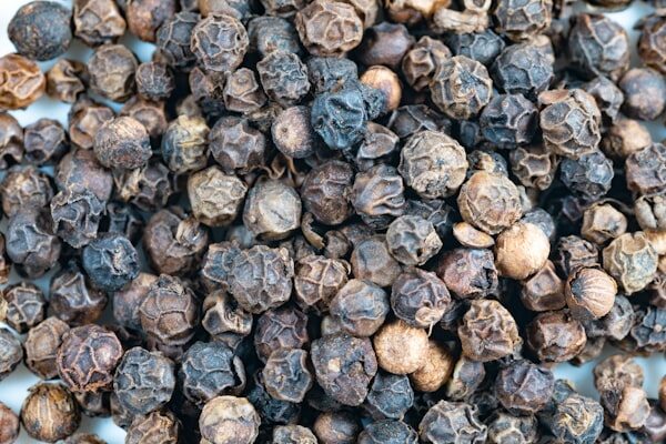 Close up pile of black peppercorns